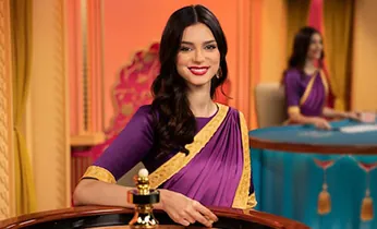 Bàn chơi Baccarat trực tiếp với người chia bài và các lá bài được chia, tạo không gian sang trọng và chuyên nghiệp.